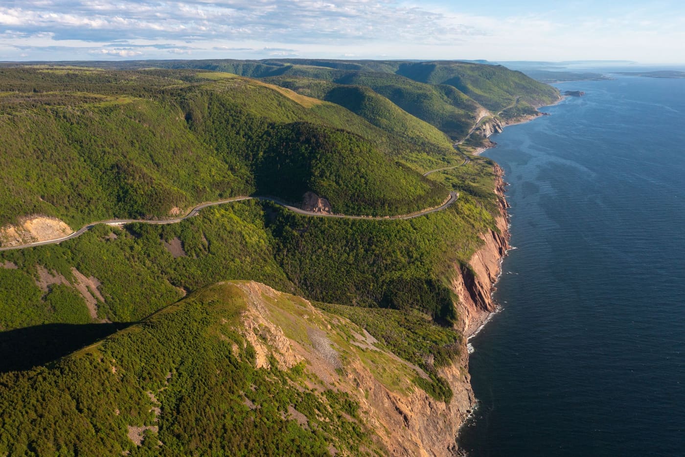 The Cabot Trail following the cliffs of the Cape Breton coast from the air