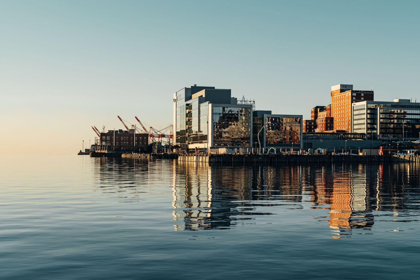 The Halifax waterfront at first light, reflected in a calm harbour