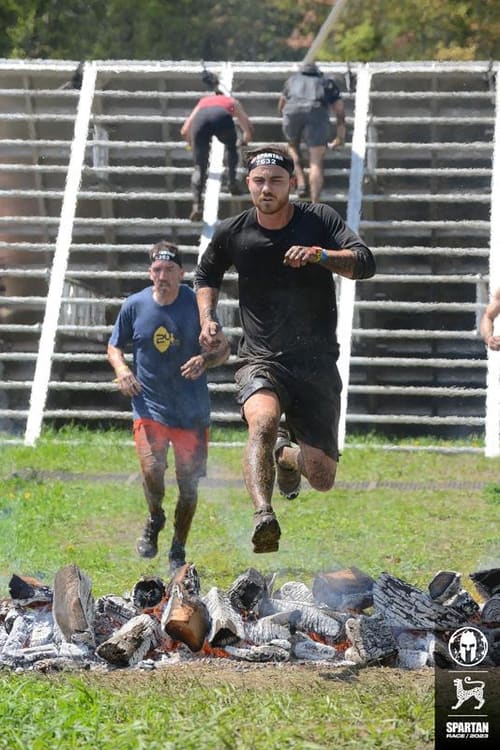 Riley mid-stride in a Spartan obstacle race